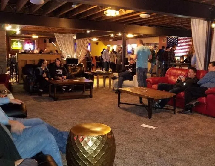 Couches and warm lighting in the downstairs Rock Bottom whiskey bar